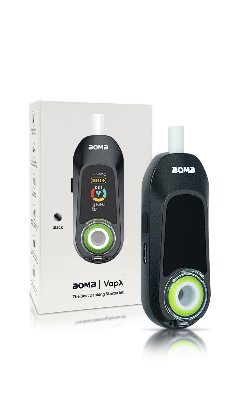 The Bomb x VapX Magic Bean vaporizer standing next to its premium retail box. The packaging mirrors the limited-edition collaboration aesthetic, and the image highlights the compact scale of the device relative to its professional presentation.