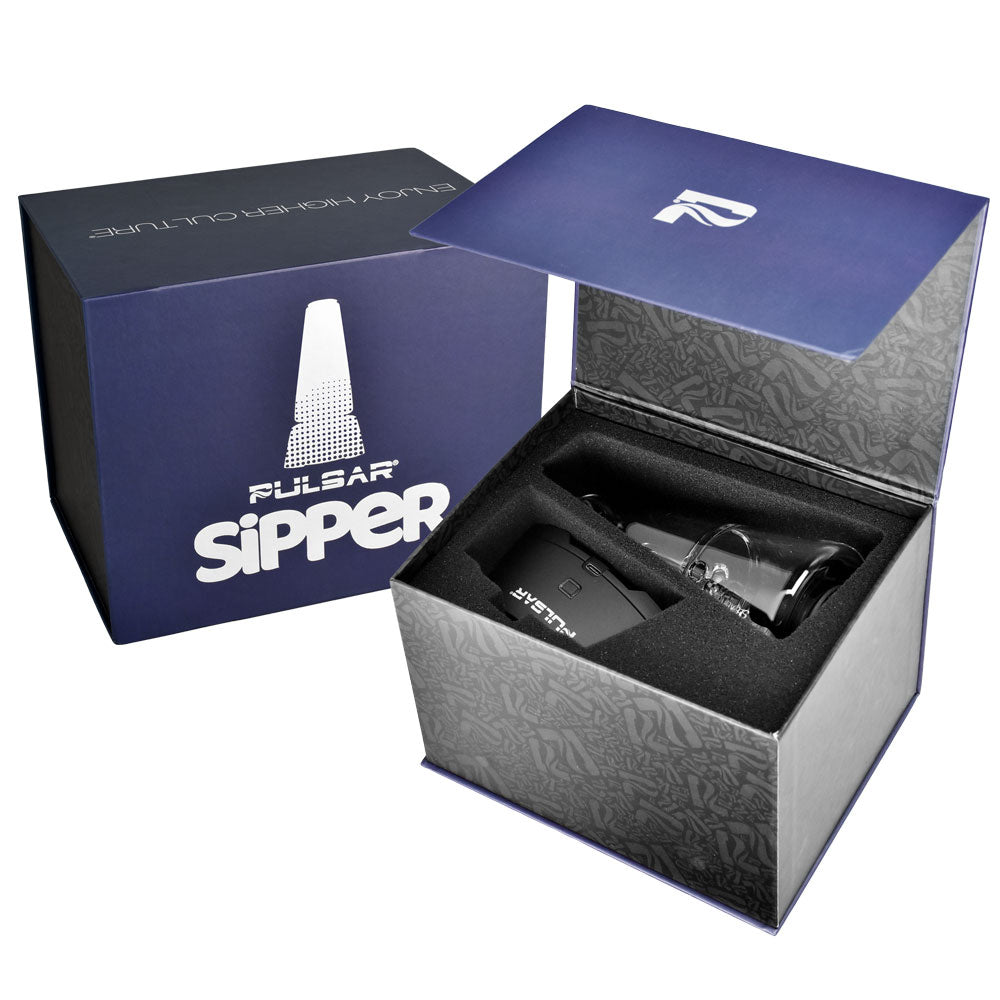 A side-by-side shot of the Pulsar Sipper Bubbler Cup Edition packaging. On the left is the fully enclosed retail box with its vibrant, high-end product graphic; on the right is an open box revealing the form-fitting, protective internal foam inserts where the device, glass bubbler, and dynamic accessories are securely housed for transit.