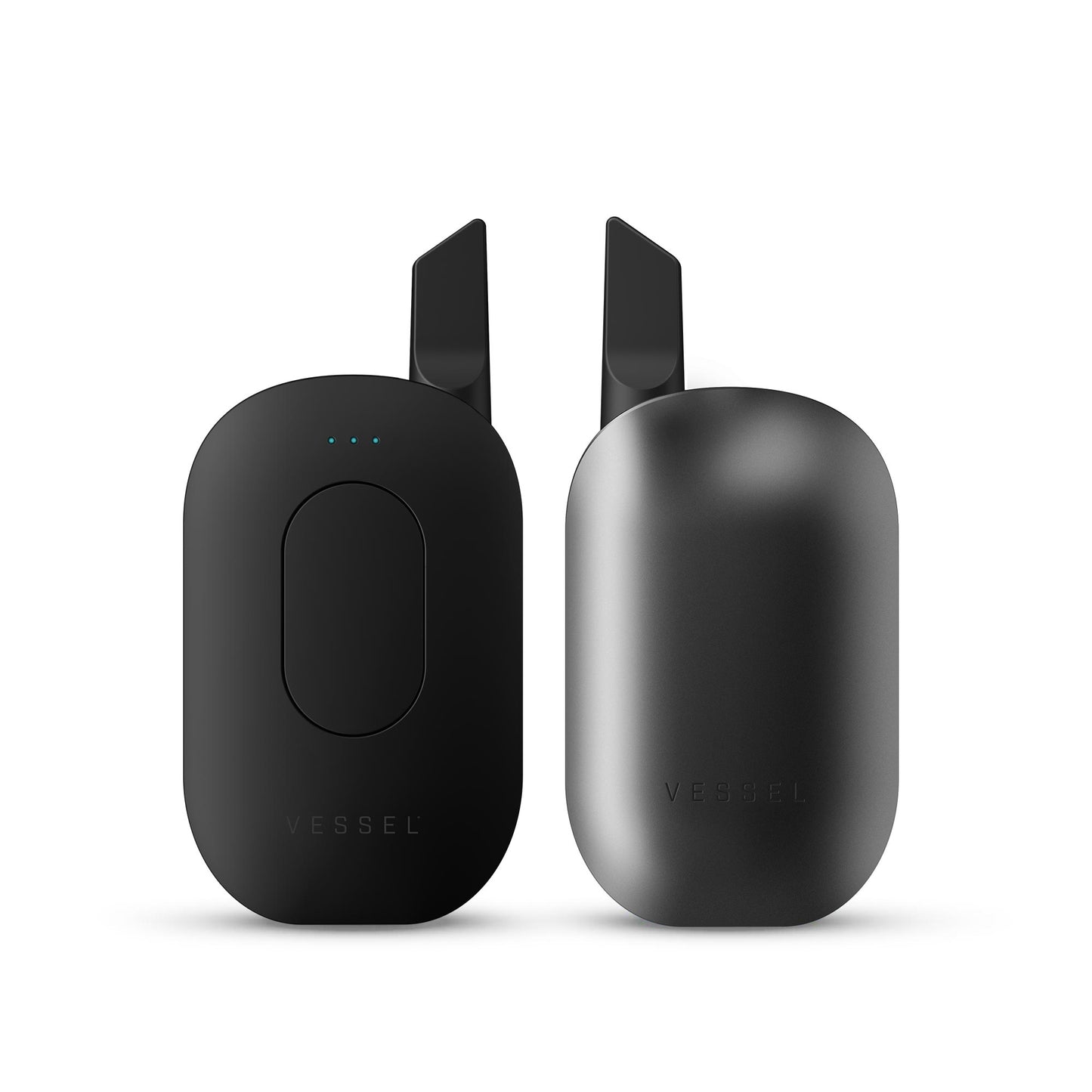 A clean studio product shot displaying two Vessel Compass Gunmetal vape batteries side-by-side for a complete 360-degree layout view. The device on the left faces directly forward, detailing the sleek central control button, the 3-LED array, and an installed 510 oil cartridge. The matching device on the right is turned around, emphasizing the smooth, unibody back panel and the uniform dark gray industrial gunmetal finish.