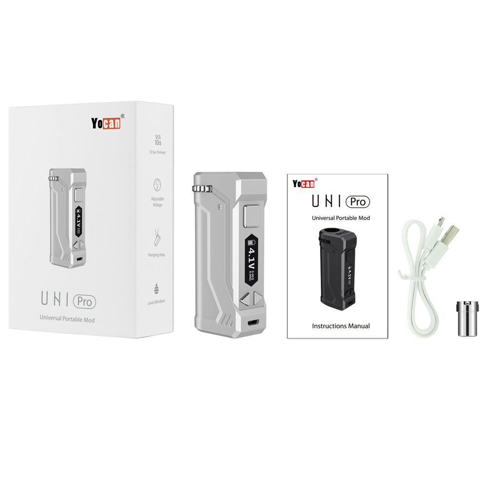 A comprehensive layout of the Yocan UNI Pro retail package. The image displays the Silver device alongside its clean white retail box, the detailed instruction manual, a white USB charging cable, and the essential 510-thread magnetic adapter. This shot illustrates everything included in a standard purchase to ensure you're ready to vape right out of the box.