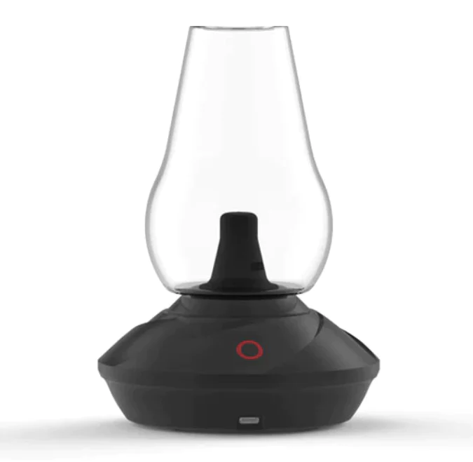 A detailed studio product shot showcasing the Zenco Duo Vaporizer in the classic Onyx colorway. The image highlights the stealthy, minimalist matte black finish of the smart base unit sitting beneath the crystal-clear glass vapor cup attachment, showing off its sleek, premium desktop appearance.
