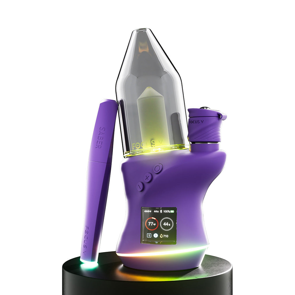 Focus V Carta 2 smart electric dab rig in vibrant purple, featuring a sleek design, OLED display, and the matching Focus V Saber hot knife tool for precise concentrate handling.