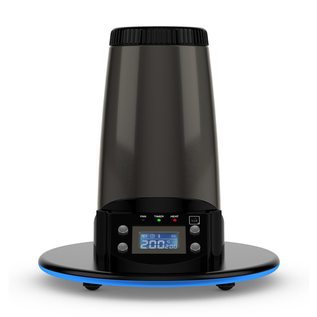 A crisp, front-facing studio product shot showcasing the Arizer Extreme Q Desktop Vaporizer standing upright. The shot highlights the sleek midnight-chrome cylindrical body, the bright blue illuminated digital LCD screen displaying temperature controls on the front panel, and the open heating chamber opening at the top peak on a clean background.