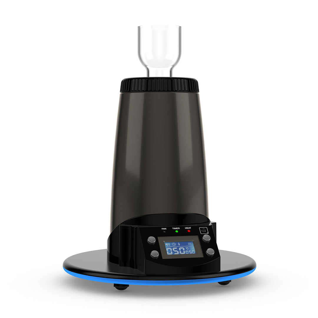 A detailed studio product shot highlighting the Arizer Extreme Q heating port with a Glass Cyclone Bowl installed. The clear borosilicate glass bowl sits securely inside the top opening of the desktop vaporizer, showcasing the clean, all-glass loading chamber designed for optimal hot air convection distribution through your dry herb materials.