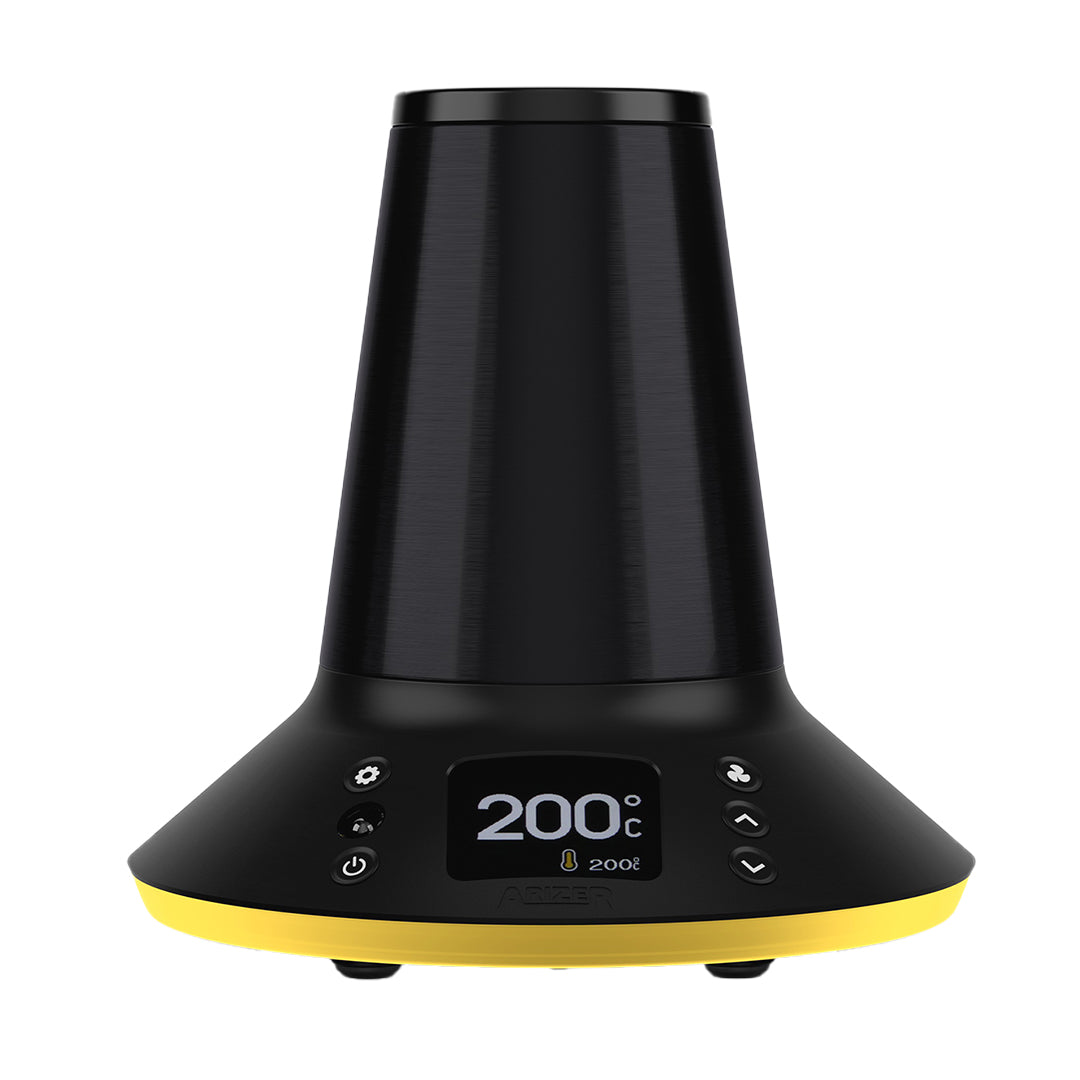 A crisp, front-view studio shot of the Arizer XQ2 Desktop Vaporizer with its dynamic LED base ring illuminated in a bright amber yellow. The shot emphasizes the device's modern status-lighting technology, indicating an active heating phase, while showing off the clear digital temperature interface and the clean, premium lines of the desktop unit's chassis.