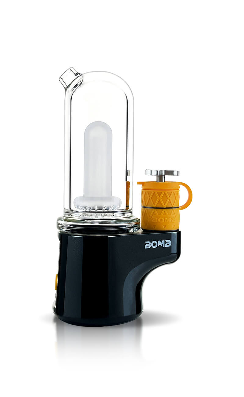 A high-resolution studio product shot showing the BOMB ERIG Sykloud Portable Electric Dab Rig in Black from a side perspective. The photo displays the glossy black base featuring the white "BOMB" logo, the clear borosilicate glass water bubbler attachment, and the side-mounted atomizer with a textured yellow silicone sleeve and metal spinner carb cap.