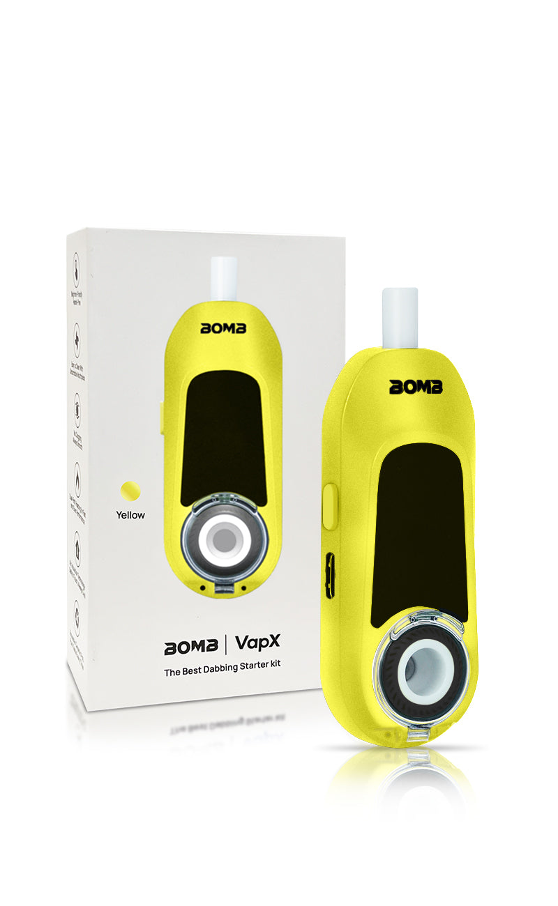 The Liquid Lemon Magic Bean standing next to its official Bomb × VapX retail box. This shot highlights the premium limited-edition packaging and showcases the device’s small scale compared to the retail presentation.