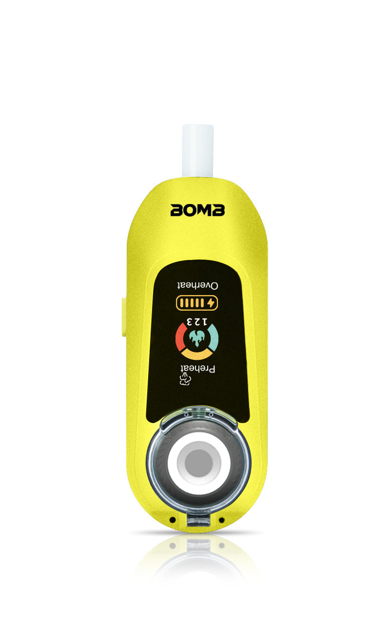A front-facing view of the Liquid Lemon Bomb × VapX Magic Bean. This shot highlights the vibrant yellow silicone body, the recessed ceramic heating bowl, and the bright lit digital display screen.