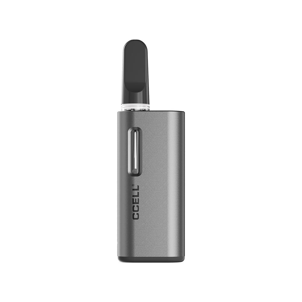 A front-facing studio shot of the CCELL Fino mini battery completely separated from its power bank dock and leather case. A clear glass 510-thread oil cartridge is installed into the top port, demonstrating how the miniature, rectangular silver vape unit remains smaller than the cartridge itself for ultimate pocket discretion.