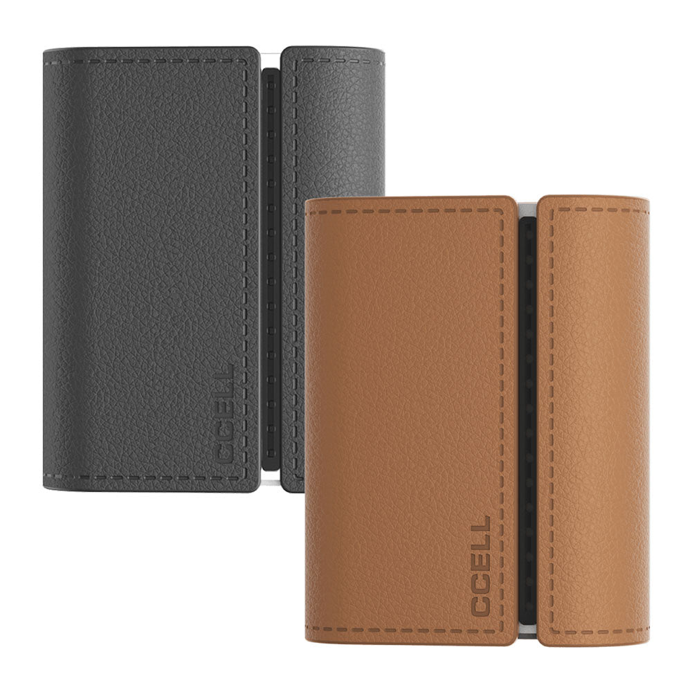 A clean front-facing studio lineup shot of the CCELL Fino in Cocoa with Moon Gray and Obsidian with Platinum. Both modular systems are displayed side-by-side in their closed profiles, highlighting the compact rectangular geometry, premium textured leather finishes, and the subtle CCELL branding elements.
