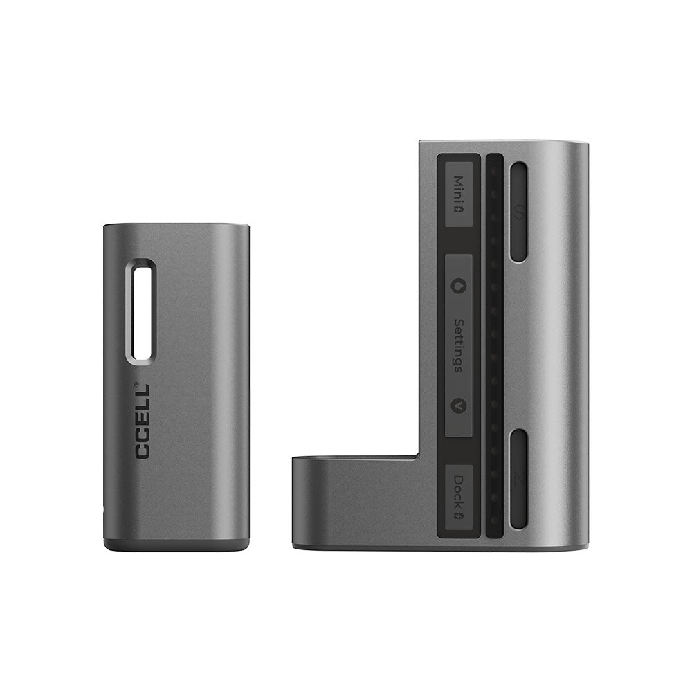 A deconstructed product presentation showing the CCELL Fino hardware without its leather case. The ultra-compact, rectangular silver mini vape battery is shown completely detached from the open, platinum-colored power bank charging dock, highlighting the internal magnetic contact pins and modular engineering.