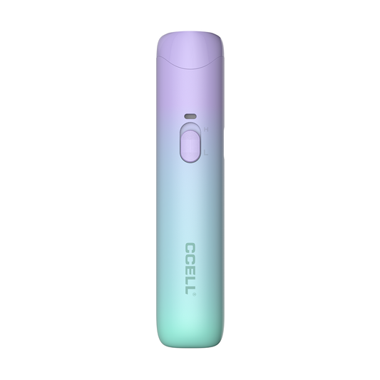 A front-facing studio shot of the CCELL Go Stik 510 Battery in Electric Blue. The device features a stunning two-tone gradient that transitions from a soft purple at the top to a vibrant teal-blue at the base. The image clearly shows the LED indicator, the "H/L" voltage slider, and the silver CCELL branding on the anti-slip matte body.