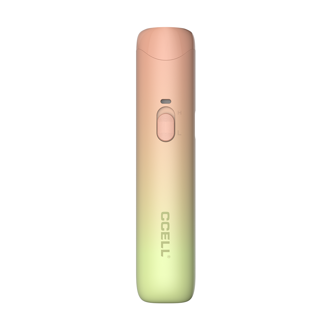 A front-profile view of the CCELL Go Stik 510 Battery in Sunset Blush. This variant showcases a warm, aesthetic gradient moving from a soft coral-pink at the top to a pale lime-yellow at the bottom. The slim, flat-pen design is highlighted against a white background, emphasizing its portable and roll-resistant shape.