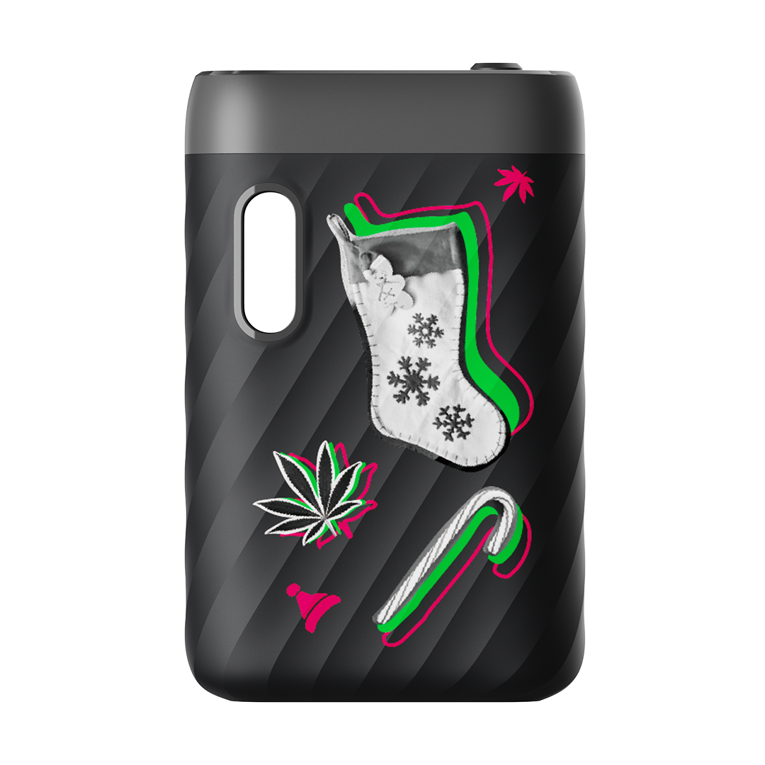 A front-facing studio shot of the CCELL Sandwave 510 Battery Christmas Edition. This limited-run variant features the classic Midnight Black "wave" body adorned with festive graphics. The design includes a holiday stocking with snowflake patterns, a candy cane, and a Santa hat, all styled with a modern pink and green "glitch" neon outline.