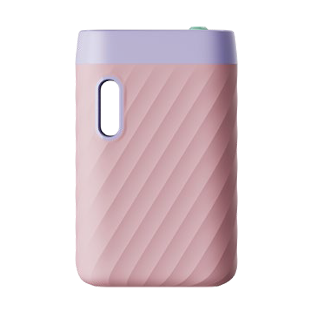 A front-facing vertical shot of the CCELL Sandwave 510 Battery in Coral Pink. The device features a warm, matte pink body with a soft lavender top cap. This shot highlights the signature "wave" textured grip, the oval oil viewing window, and the ergonomic, palm-friendly design.