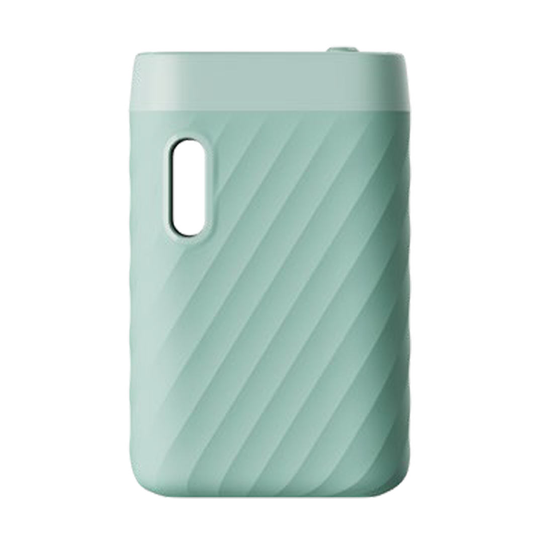 A front-facing studio shot of the CCELL Sandwave 510 Battery in Mint Green. This variant features a soft, pastel green matte body with a slightly lighter green top cap. The image highlights the ergonomic wavy texture and the vertical cartridge viewing window, showcasing the device's stylish and palm-sized design.