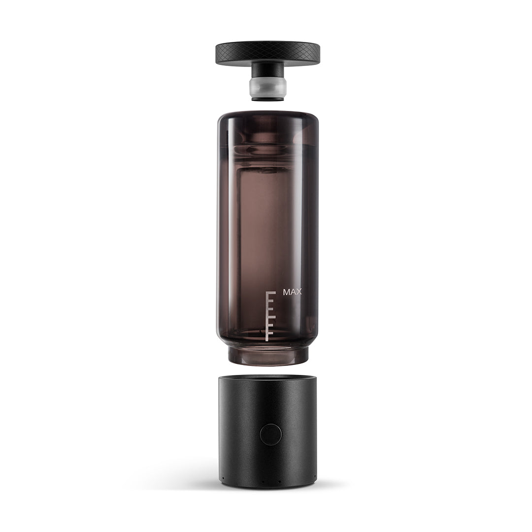 A crisp, front-facing studio product shot displaying the Cloudious9 Carti9 completely disassembled in an exploded view. The metallic top cap hovers above the clear borosilicate glass tube, which in turn hovers directly above the black anodized aluminum alloy battery base, visually demonstrating how the modular water-filtration system pieces together.