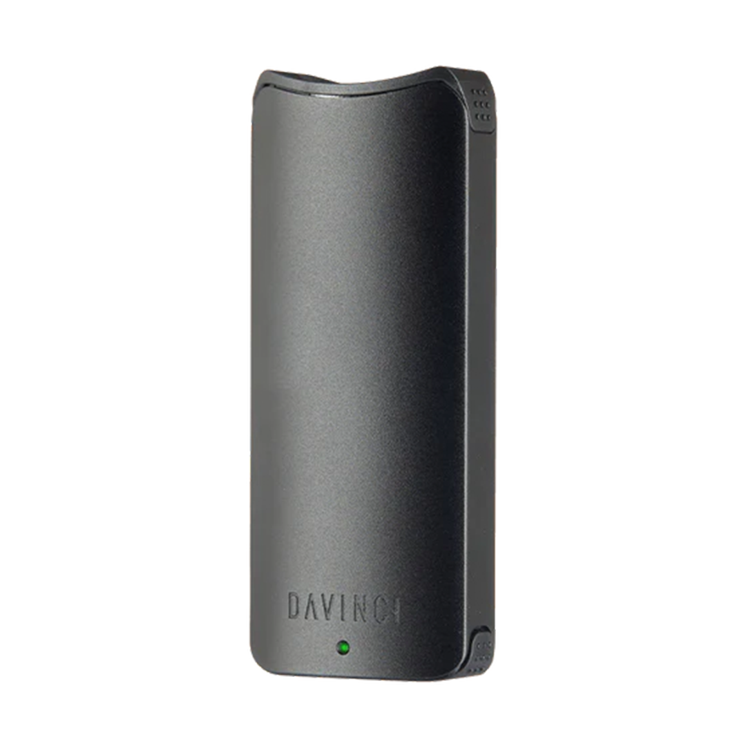A clean front-facing studio shot of the DaVinci ARTIQ in Black. The device features a premium, matte black metallic finish over its sleek, vertical rectangular chassis, showcasing the clean lines, subtle front-facing LED indicator dot, and the ergonomically curved top mouthpiece opening.