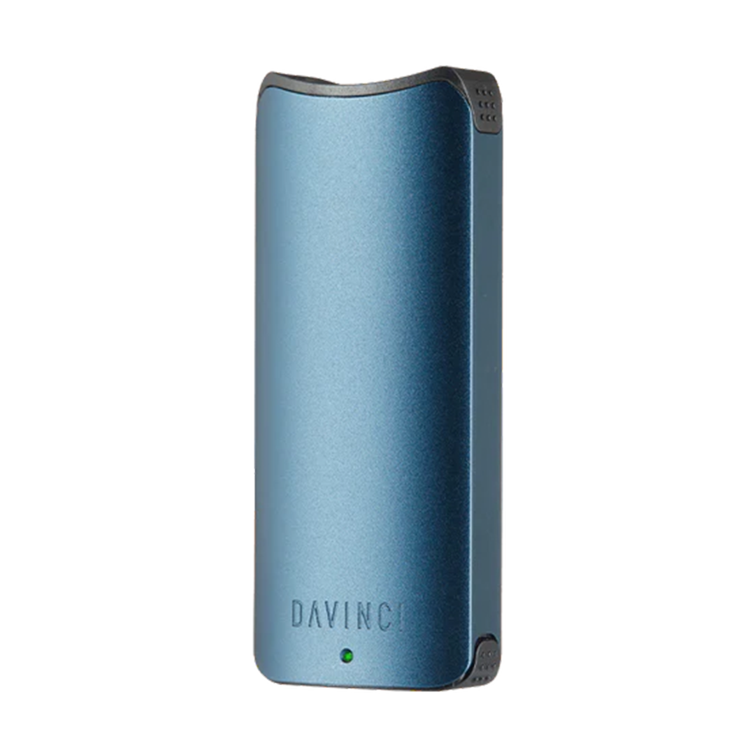 A front-facing studio shot of the DaVinci ARTIQ in Blue. The device features a vibrant, smooth sapphire blue matte metallic finish across its sleek rectangular chassis, emphasizing its clean, modern tech aesthetic and ergonomic top mouthpiece interface.
