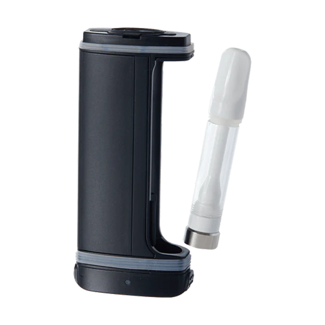 A detailed deconstructed product shot of the DaVinci ARTIQ in Black with its protective outer sleeve removed. The image clearly demonstrates a standard 510-thread oil cartridge installed via the magnetic base adapter into the internal recessed firing track, illustrating how the shell completely conceals the glass hardware.
