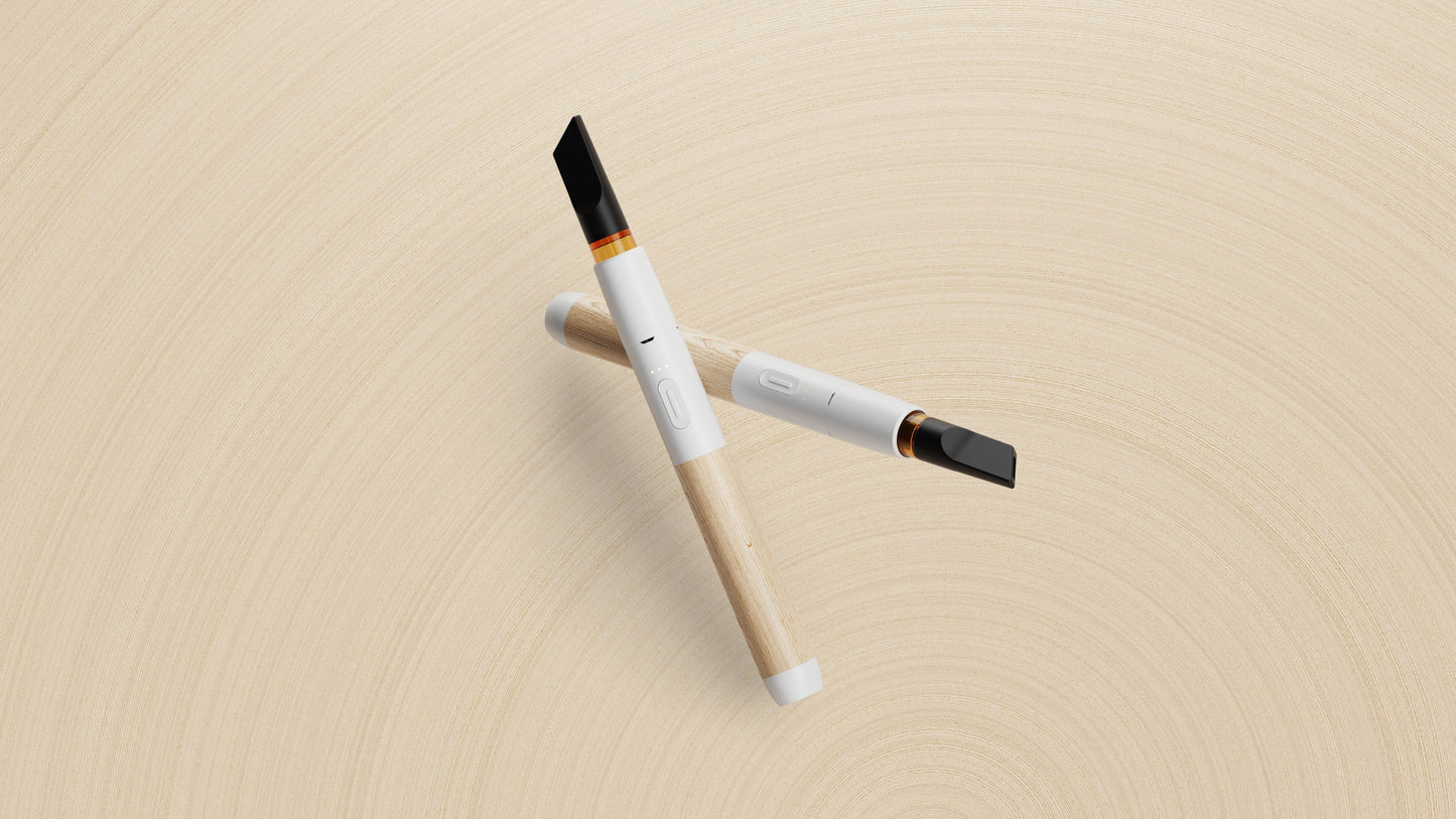 A high-end studio product shot showcasing two Vessel Craftsman White and Beechwood 510 vape batteries side-by-side at symmetrical slanted angles. Both premium devices are equipped with installed 510 oil cartridges, highlighting the natural wood grain variation between the two beechwood handles and emphasizing the sleek, unibody luxury design of the collection.