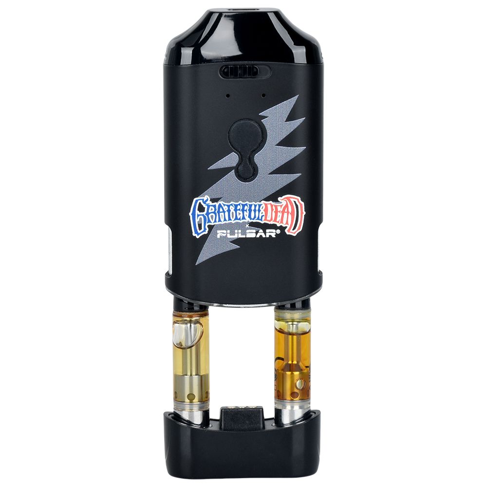 A crisp studio product shot of the Grateful Dead x Pulsar DuploCart with its outer body sleeve slid halfway up. This view completely exposes the internal engineering, showing two separate 510-threaded oil cartridges threaded side-by-side into the magnetic base tray to demonstrate the dual-firing capability.