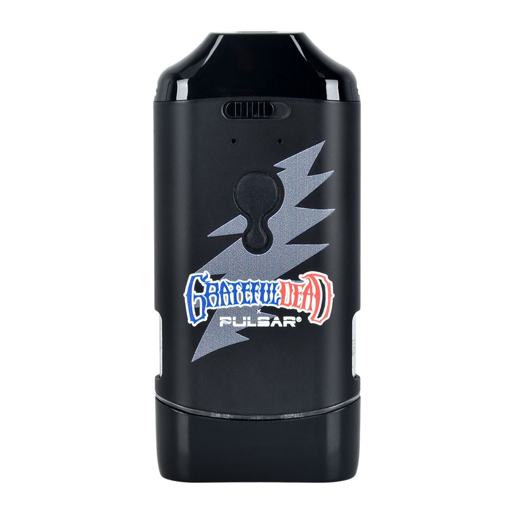 A front-facing studio shot of the Grateful Dead x Pulsar DuploCart battery. The front profile highlights the official stylized Grateful Dead logo printed in white, situated directly above the central tactile power button, the color-coded LED light indicator strip, and the quick-access dual cartridge windows.