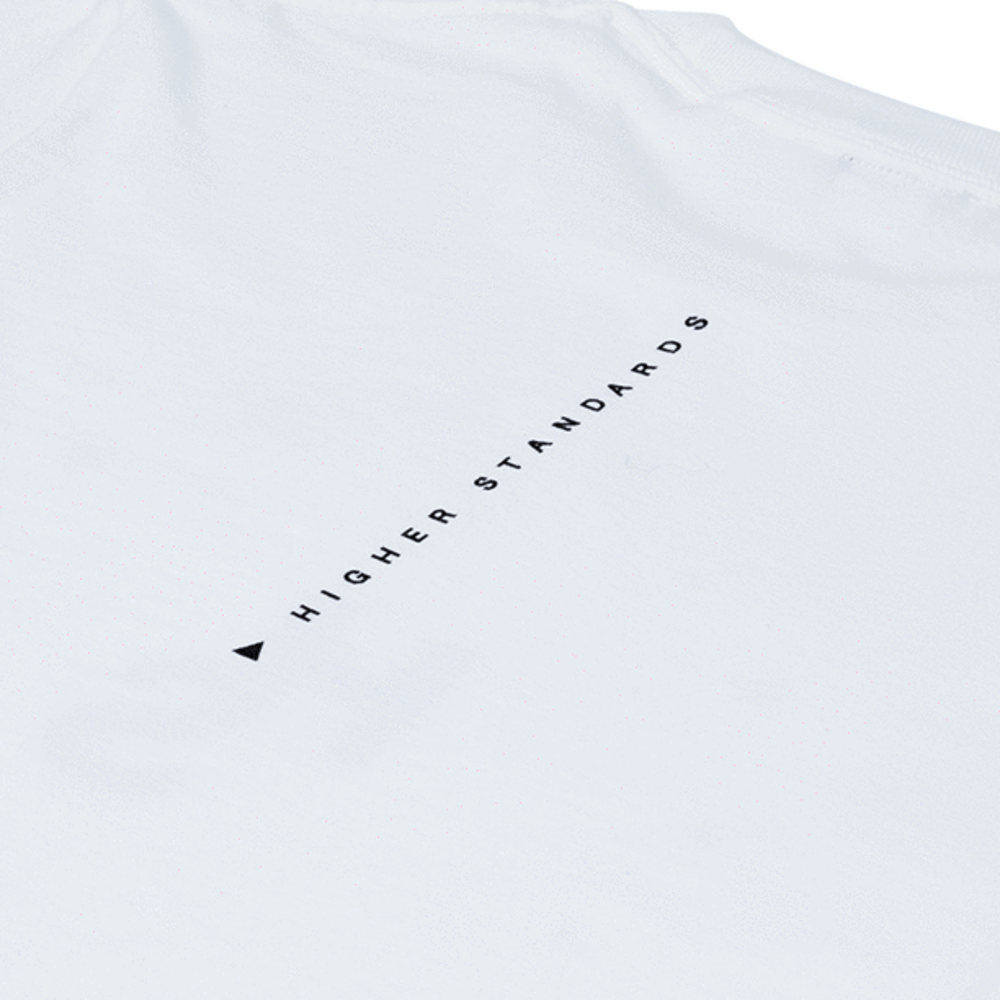 A detailed close-up shot focusing on the high-quality vertical back print of the Higher Standards T-shirt against the crisp white cotton fabric.