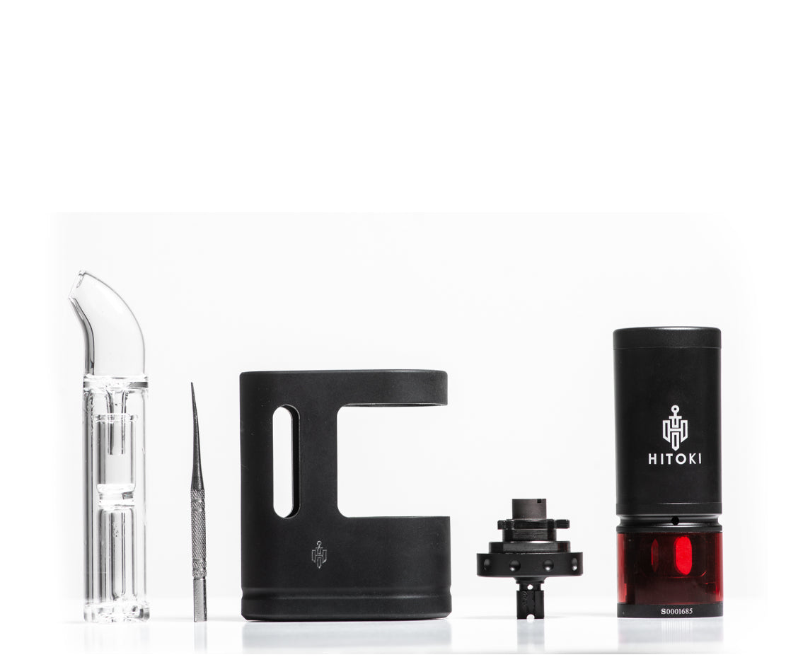The Hitoki Saber Portable Kit shown disassembled to highlight its components. This view displays the main laser base, the internal ceramic loading chamber, and the screw-on portable attachment, illustrating the ease of maintenance and portability.