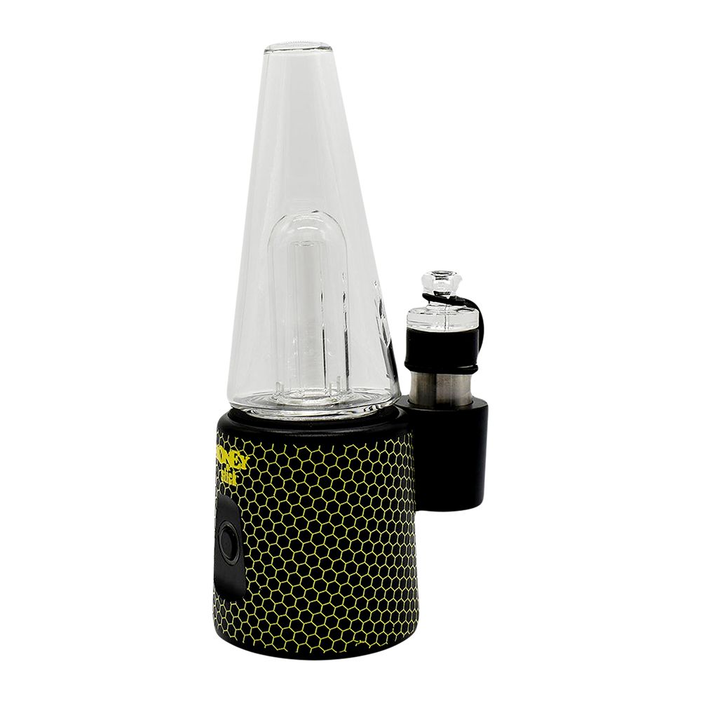 A side-angle studio product shot of the HoneyStick Ripper E-Rig, displaying the textured yellow-and-black honeycomb chassis, side-mounted atomizer bracket with silicone carb cap tether, and clear glass water chamber top.
