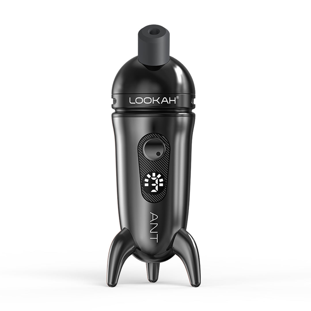 A straight-on studio product shot of the LOOKAH Ant Wax Dab Pen Vaporizer in Metallic Black, featuring the dark gunmetal body finish, magnetic cap lid, power button, and "ANT" vertical logo text.