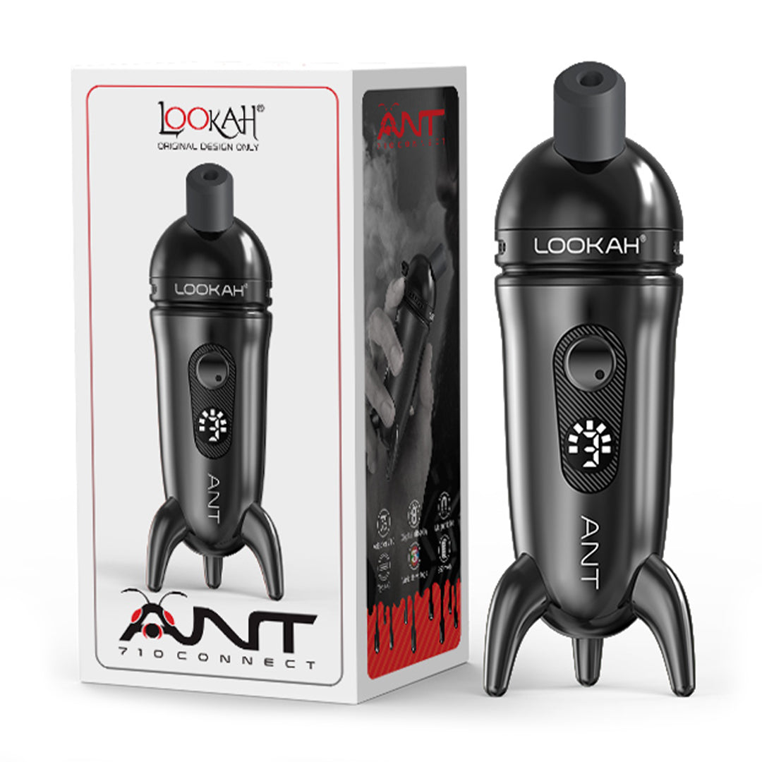 A studio product shot showcasing the LOOKAH Ant Wax Dab Pen Vaporizer in Black standing next to its official white retail packaging box, highlighting the rocket tripod base, magnetic cap mouthpiece, digital display screen, and "LOOKAH ANT" logo.