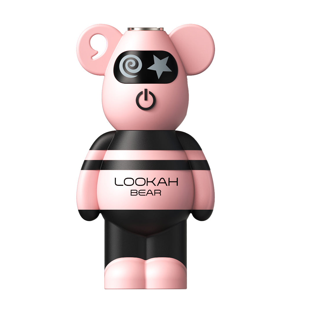 A front-facing studio shot of the Lookah Bear 510 Battery in Pink. The device features a soft pastel pink silicone head and feet, contrasted by a black-and-pink striped torso. The bear’s characteristic star-and-swirl eye design is centered above the circular power button, highlighting the brand's high-end, playful aesthetic.