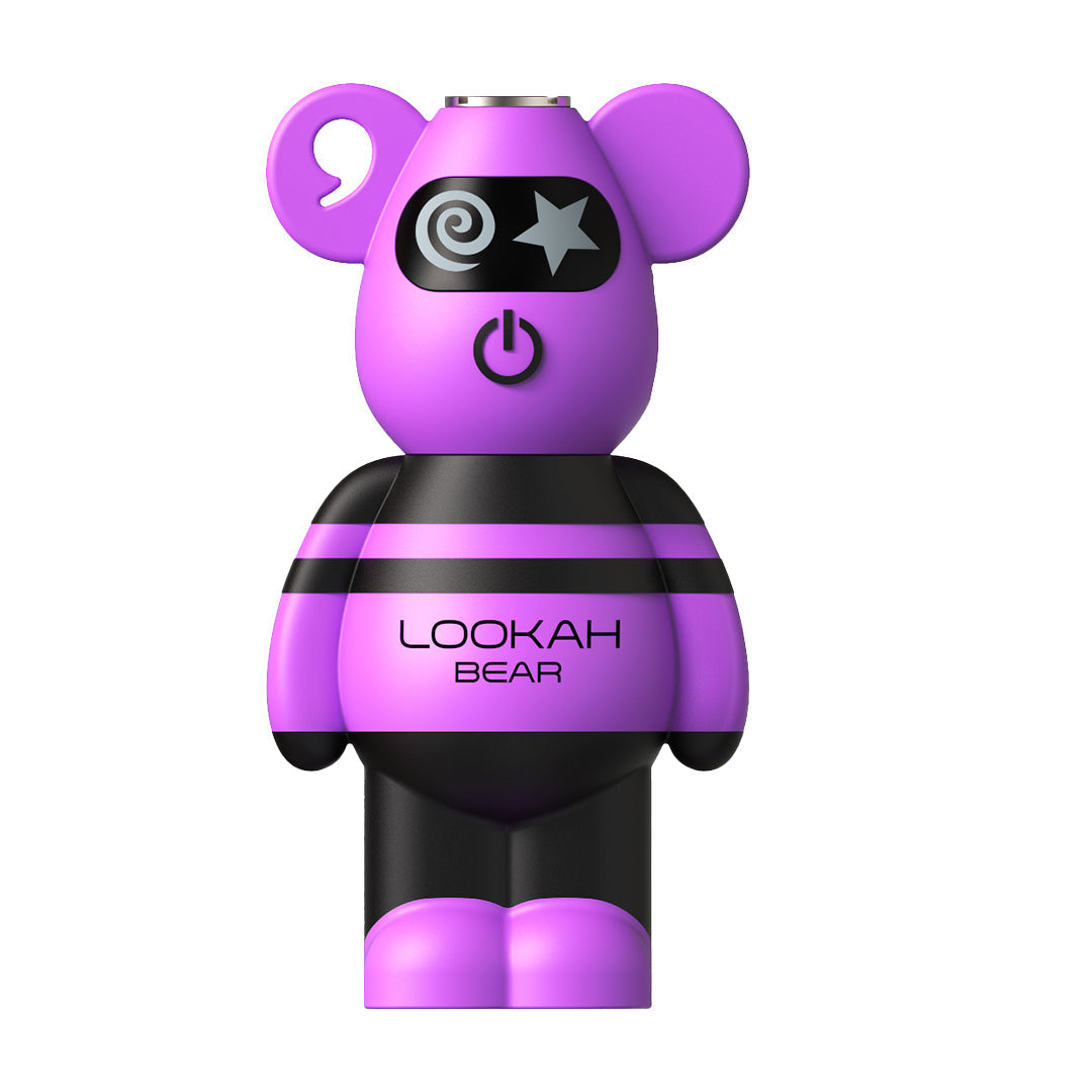 A front-facing studio shot of the Lookah Bear 510 Battery in Purple. This version features a solid, vibrant purple silicone head and feet, contrasted by the signature black stripes on the torso. The image clearly shows the central power button and the star-and-swirl eye motif that defines the Bear's character design.