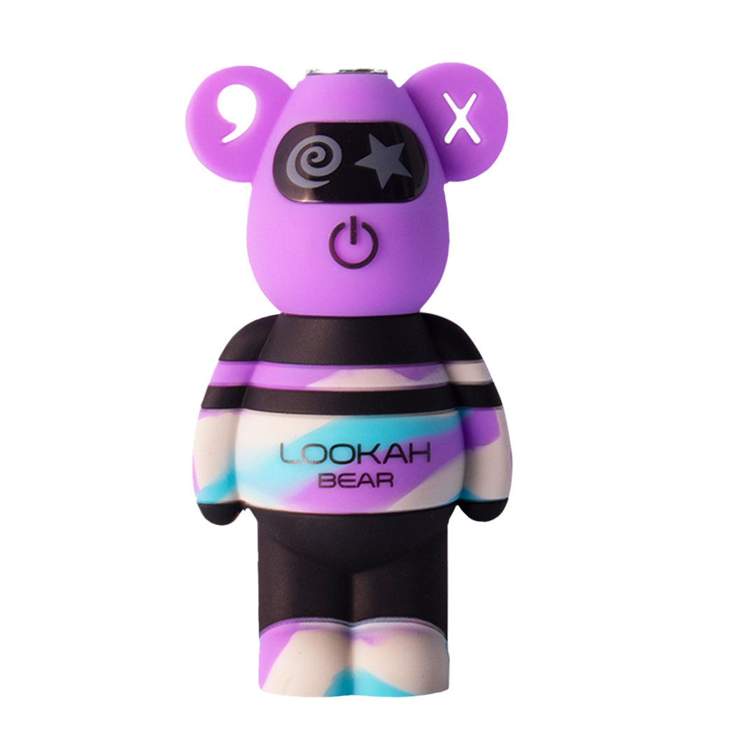 A front-profile view of the Lookah Bear Battery in Purple TieDye. This version showcases a solid purple head with a distinct "X" design in the left ear, while the torso and feet feature a marbled tie-dye pattern of purple, white, and teal. This design emphasizes the unique, collectible nature of the TieDye series for the Bong Bros storefront.