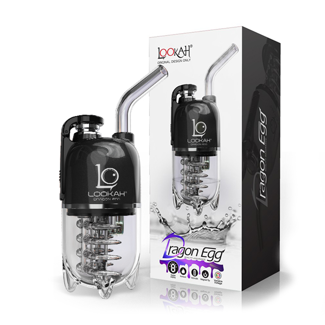 A detailed studio product shot displaying the fully assembled LOOKAH Dragon Egg Vaporizer in Black standing upright next to its official graphic retail box. The shot captures the sleek, stealthy matte black finish of the egg-shaped electronic dab rig base, highlighting the magnetic flip-top cap, glass mouthpiece, and transparent lower water filtration section on a crisp background.