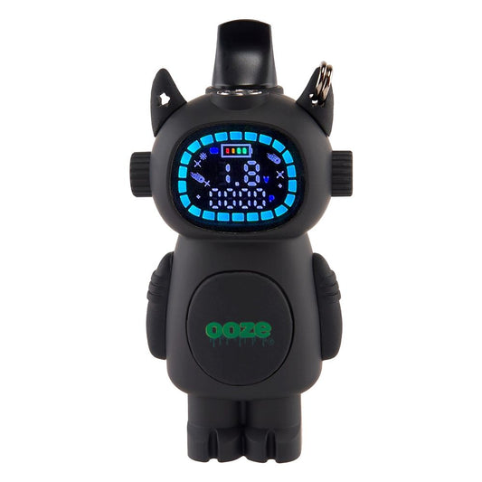 The Ooze Bot in Panther Black shown in its concealed configuration, with a 510-thread cartridge tucked inside the robot’s body. The digital "face" display is active, showing the battery percentage and puff counter.