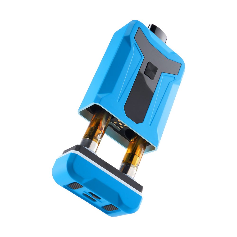A high-angle, front-slanted studio product shot of the Ooze Duet dual vape battery. The protective top casing is slid halfway off, cleanly showing two 510-threaded cartridges installed in the chamber. The perspective explicitly highlights the bottom base of the device, revealing the mechanical IntelliSwitch cartridge toggle, the dual independent airflow slider switches, and the integrated USB-C fast-charging port.