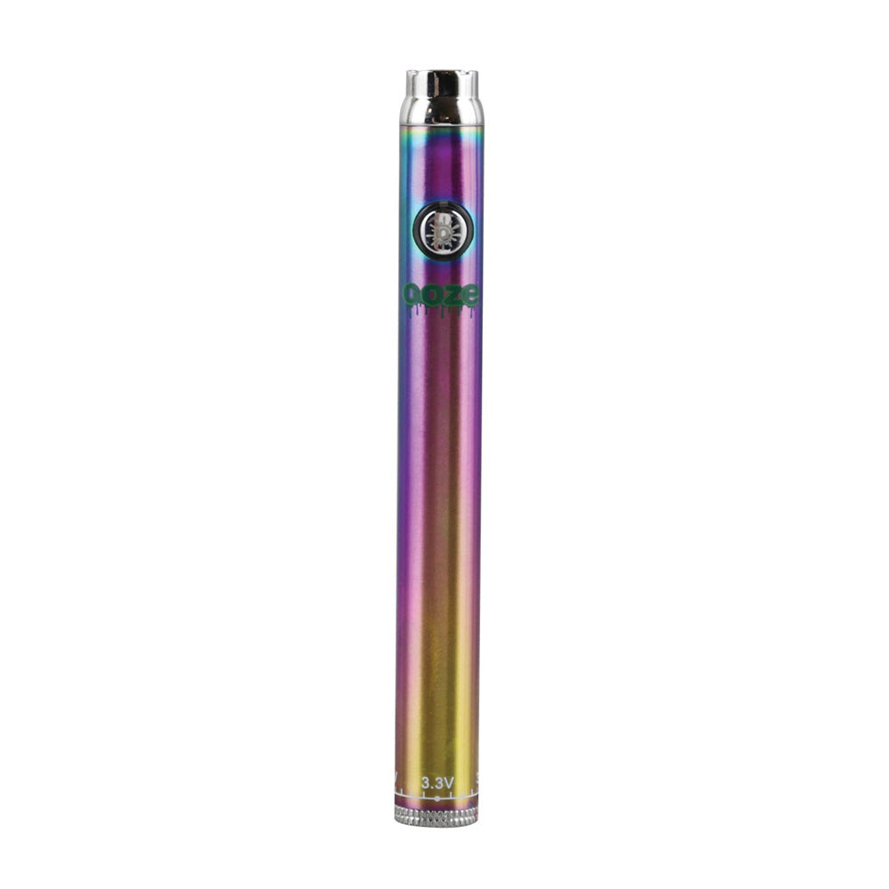 A vibrant shot of the Ooze Slim Twist Pen in Rainbow (Neo-Chrome). The image highlights the sleek, pen-style design and the multicolored iridescent finish, showcasing the firing button and the 510-threaded top connection.