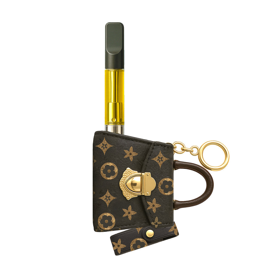 Penjamin Pursejamin keychain vape battery in a brown monogram designer print, featuring a gold-tone clasp and an upright 510 thread cartridge port for discrete portability.