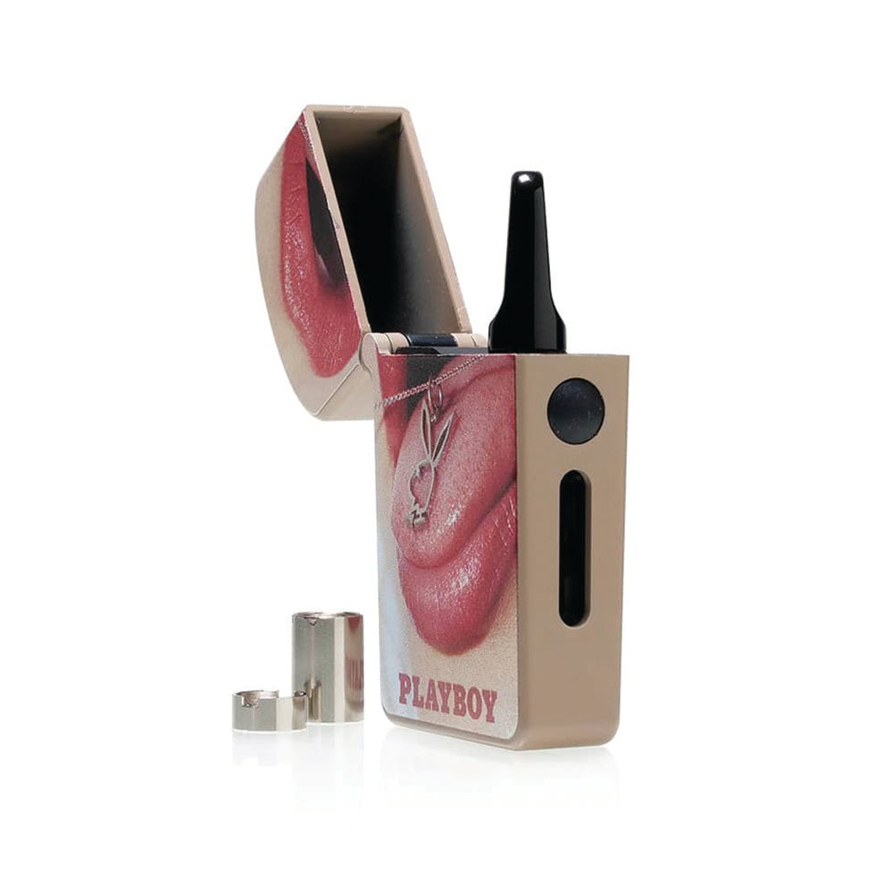 A crisp product breakdown shot featuring the Playboy x RYOT VERB 510 vape battery in the Playboy Pendant design with its top lid open. A 510 oil cartridge is shown loaded inside the internal magnetic connection chamber, with the two gold-plated magnetic connector rings neatly laid out next to it on the display surface.