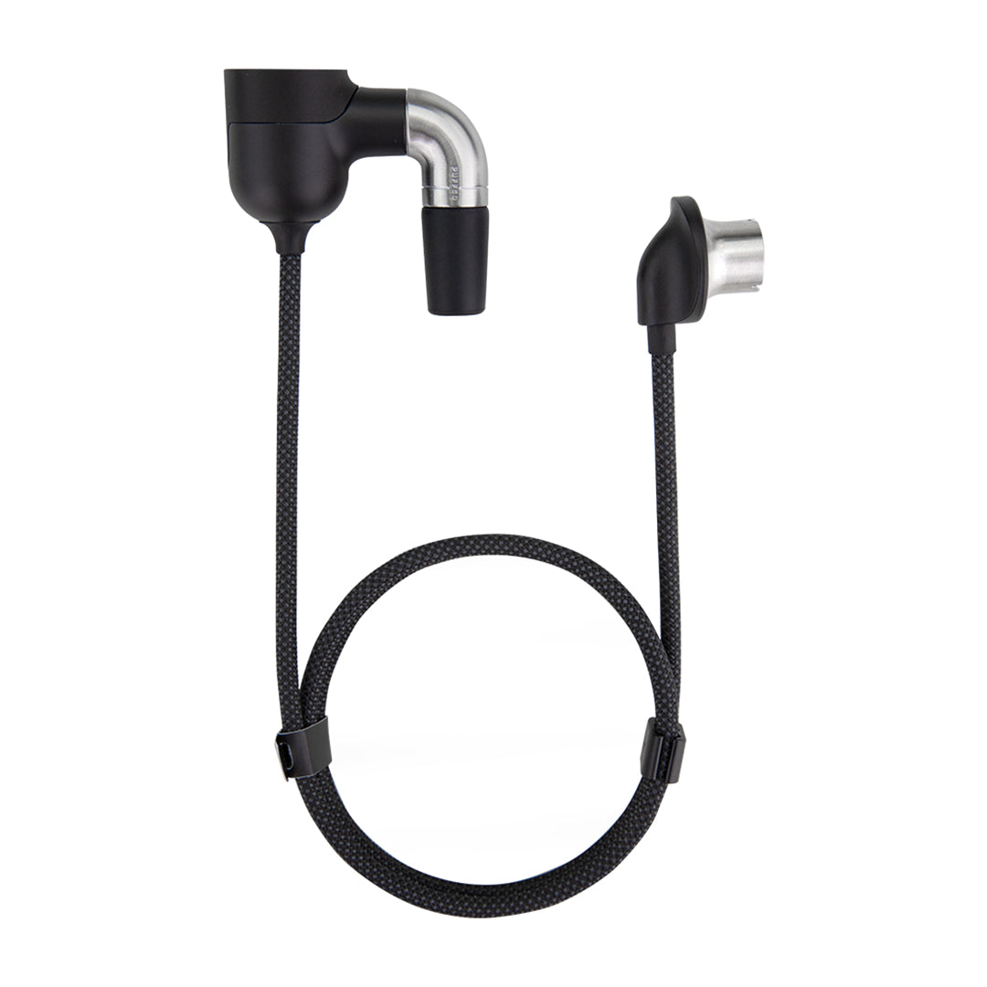 A clean front-facing studio product shot displaying the Puffco Peak Pro Link adapter kit. The shot showcases the sleek black adapter setup with its 30-inch insulated extension cable running between the rig adapter end and the device connection point, laid out neatly on a solid background alongside its weighted desktop rest stand.