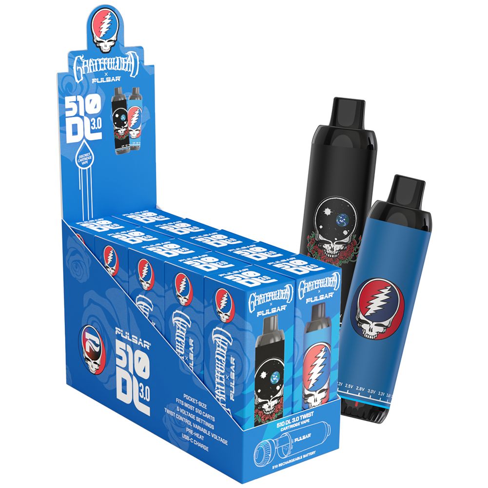 A Pulsar x Grateful Dead 510 DL 3.0 Twist retail display unit containing both editions, with the Space Your Face and Steal Your Face devices standing next to the box.