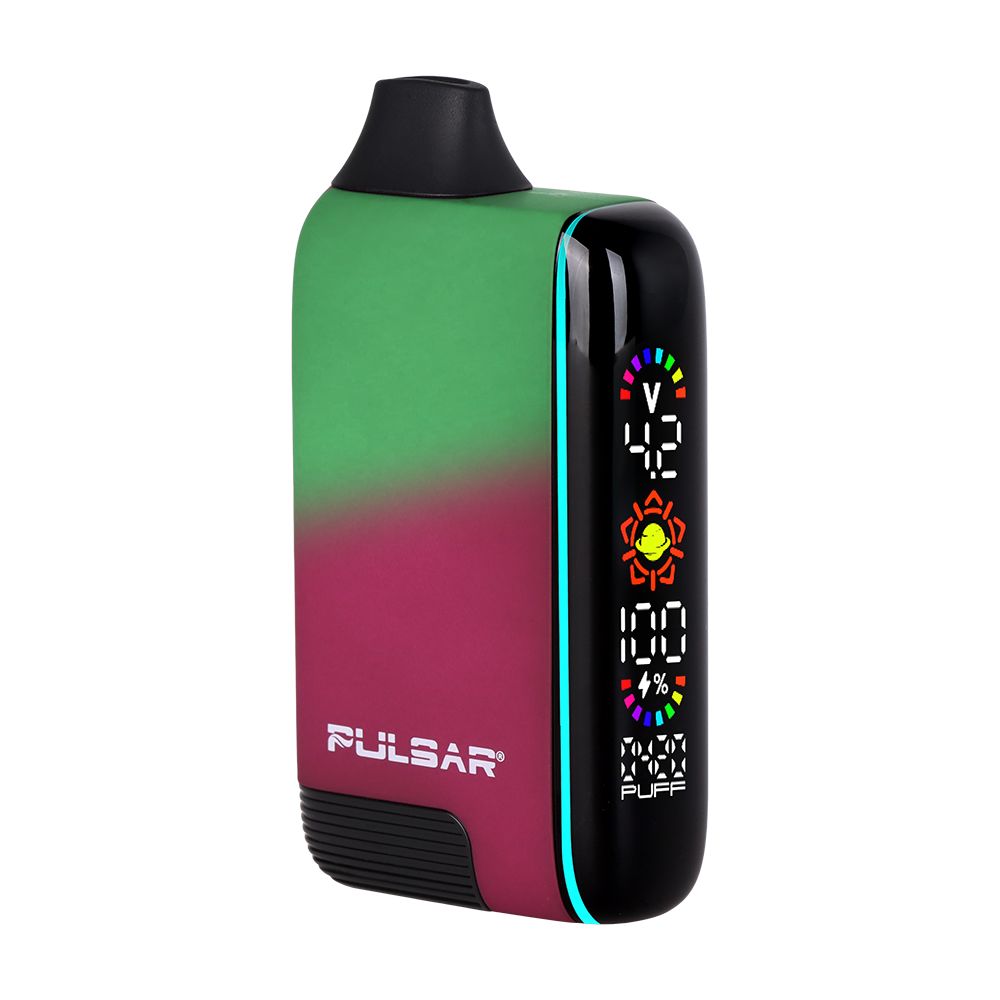 Pulsar 510 DL 5.0 Thermo in Fairy Fire, captured mid-transition to show the pink exterior reacting to heat and turning green, with the LCD screen illuminated showing voltage.
