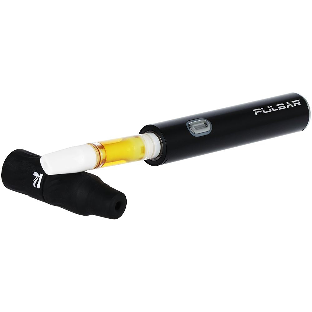 Close-up of the Black Pulsar 510 Delta smart battery with a 510 cartridge and the protective wax cap resting alongside it.