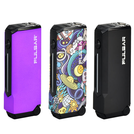 A studio display of three Pulsar 510 Dunk 2-In-1 Vaporizers standing side-by-side. From left to right, the finishes shown are Thermo Purple (a dynamic color-changing gradient), Space Junk (a stylized, psychedelic space-themed graphic pattern), and solid matte Black, highlighting the device's compact, button-operated rectangular frame.