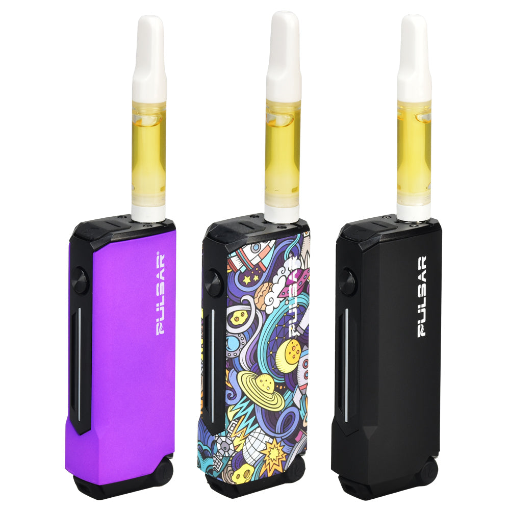 A product shot of three Pulsar 510 Dunk devices in Thermo Purple, Space Junk, and Black, shown with 510-thread oil cartridges installed. The view demonstrates the top-mounted recessed 510 connection, illustrating how neatly standard oil carts integrate with the battery body for an ergonomic profile.