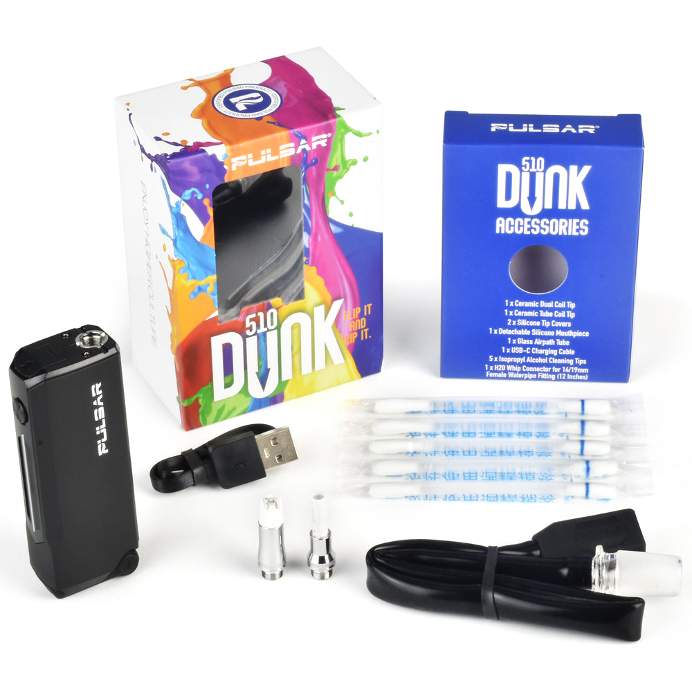 A comprehensive product layout featuring the Pulsar 510 Dunk retail box standing next to its matching parts box. Arranged in front are the unboxed contents: the matte black hybrid battery, a flexible translucent silicone H2O water pipe adapter hose, specialized white ceramic dab tips, a black silicone coil sleeve, and a black USB-C charging cable.