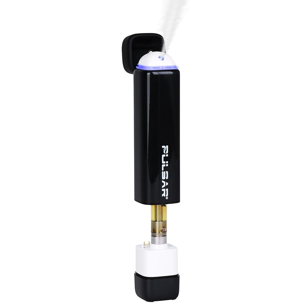 The Pulsar 510 Jetpack in Abyss, demonstrating the Forced Airflow technology with vapor visibly blowing from the mouthpiece while the internal cartridge chamber is exposed.