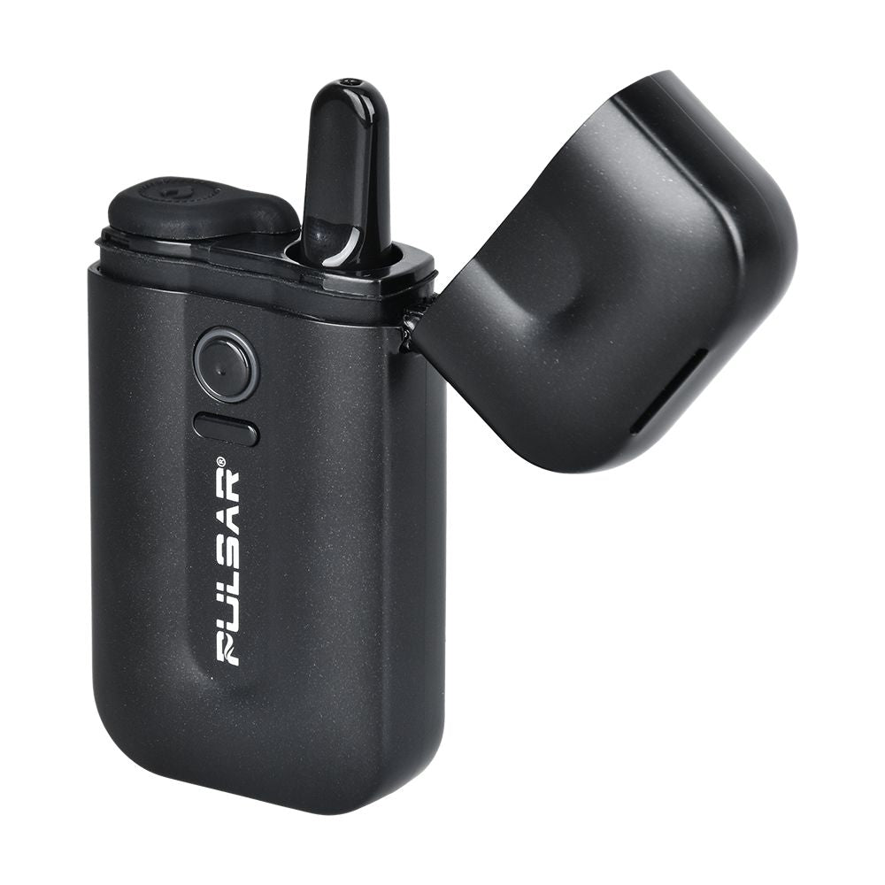 A front-angle studio shot of the Pulsar 510 VLT in Thundercloud Black with the main flip-top lid open. The opened cap reveals a clear glass 510-thread oil cartridge installed inside the concealed chamber, showcasing how the mouthpiece stays protected when closed but perfectly accessible when flipped back.